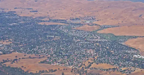 Aerial view of Clayton, California set against the golden hills near Mount Diablo